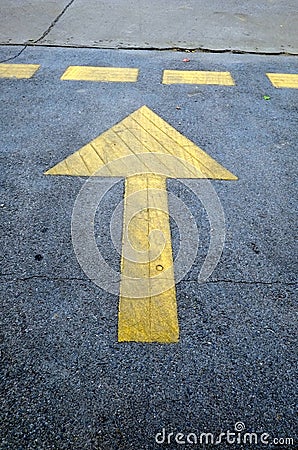 Straight arrow sign on road