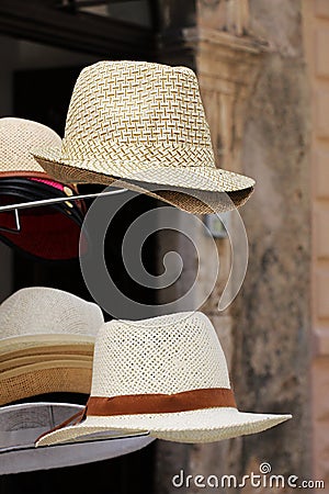Straw hats on a stand