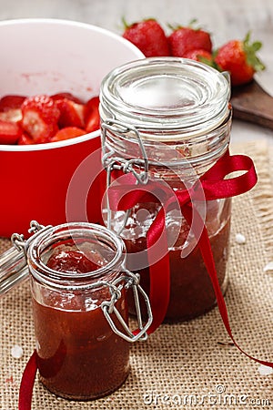 Strawberry jam in preserving glass