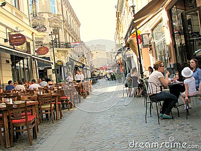 Street with coffee shops in the old city of Bucharest