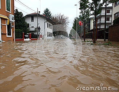 Street flooded with mud and debris during a flood in town