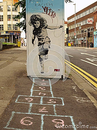 Street Graffiti of a Girl Playing Hopscotch