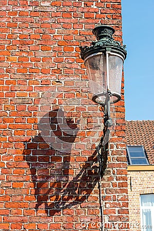 Street lanter and brick wall