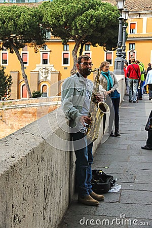 Street musician playing the saxophone in Rome, Italy