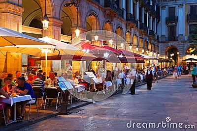 Street restaurants at Placa Reial in night. Barcelona