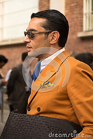 Street Style: People waiting to attend the Fendi Fashion Show in Milan, June 23rd 2014.