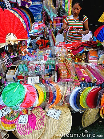 Street vendor selling colored fans in quiapo, manila, philippines in asia