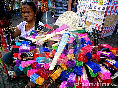 Street vendor selling colored fans in quiapo, manila, philippines in asia