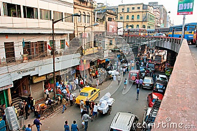 Street view from above with private cars, taxi cabs and working people