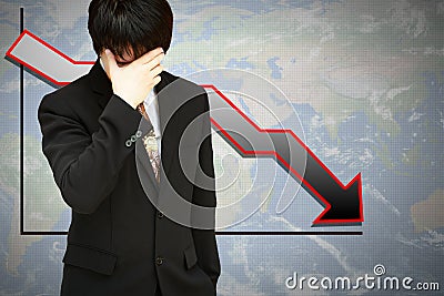 Stressed businessman with low financial graph