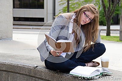 Stressed student studying on campus