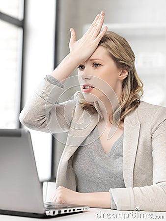 Stressed woman with laptop computer