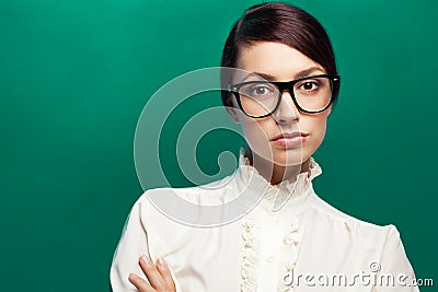 Strict woman in large glasses