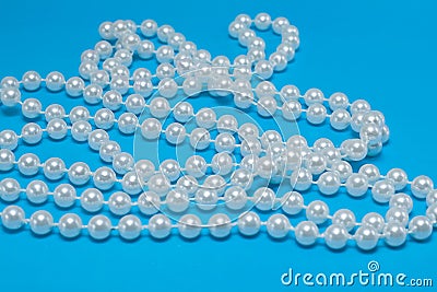 String Of Pearls On Blue Stock Photo - Image: 