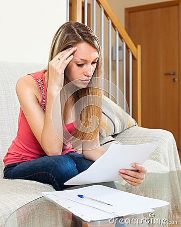 Student girl reading notes and preparing for exams