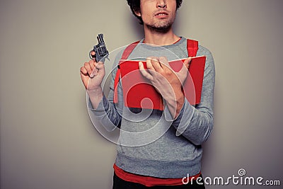 Student with gun and book