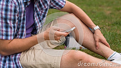 Student hands with mobile phone.