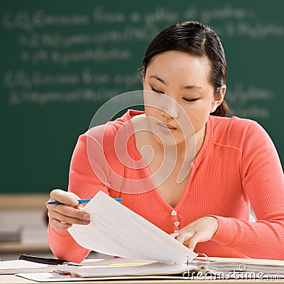 Student with notebook doing homework