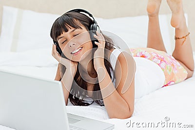 Student in pajama enjoying music