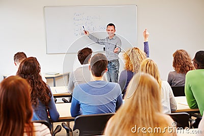 Student raising hand in school