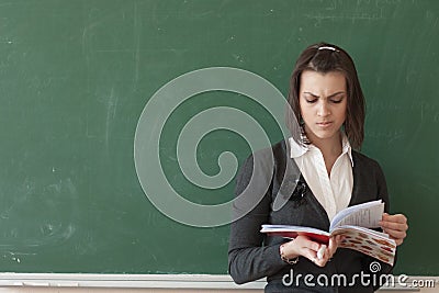 Student reads a notes of the board