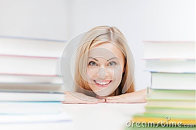 Student with stack of books