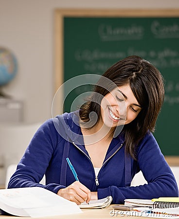 Student with text books doing homework
