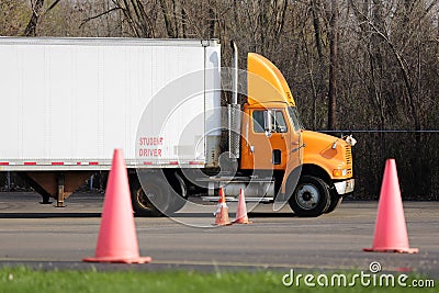 Student truck driver practices parking maneuvers