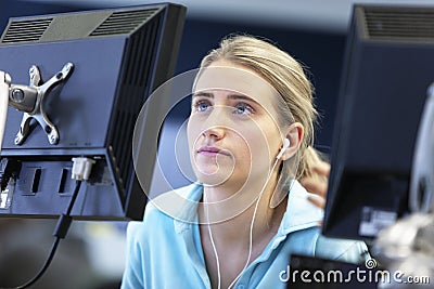 Student Using Computer And Listening Music