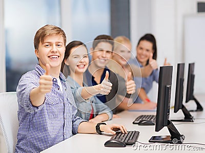 Students with computer monitor showing thumbs up