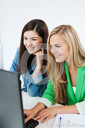 Students looking at tablet pc at school