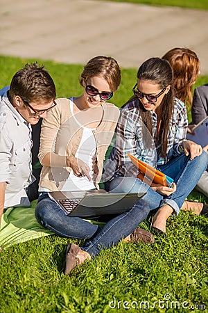 Students or teenagers with laptop computers