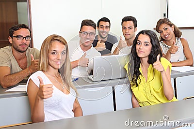 Students with thumbs up in class room