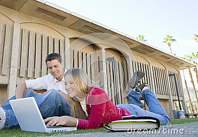 Students Using Laptop On College Campus