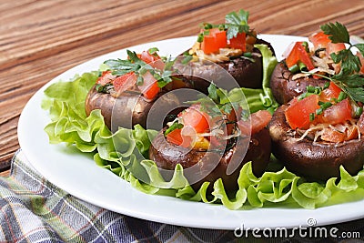 Stuffed portobello mushrooms closeup on a white plate