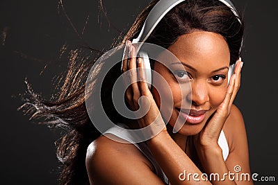 Stunning happy black woman wearing headphones