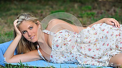 Stunning young blonde woman in sundress