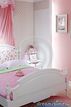 Stylish pink bedroom with double bed