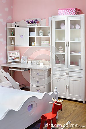 Stylish pink bedroom for girl with bed