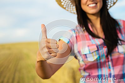 Successful agriculture female farmer with thumbs up