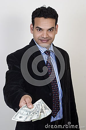 Successful business man giving money