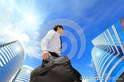 Successful business man outdoors Next to Office Building
