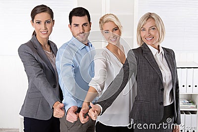 Successful business team in portrait: more woman as men with thu