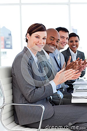 Successful international business people clapping