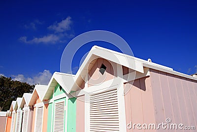 Summer beach huts on blue sky