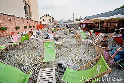 Summer chaise lounge and cheap furniture in outdoor cafe