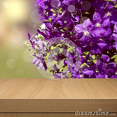 Summer floral background with empty wooden table. Floral summer