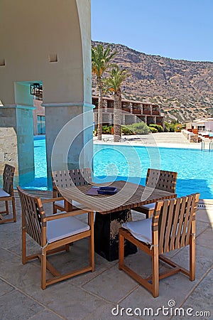 Summer hotel terrace with pool and outdoor furniture(Greece)