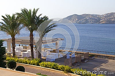 Summer outdoor restaurant terrace with sea view in Greece