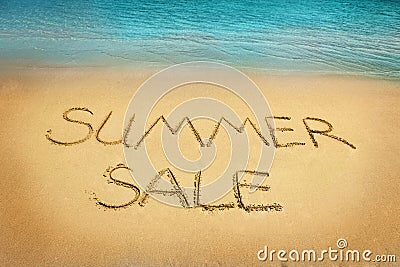 Summer sale letters on sand